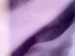 Black thong visible underneath pants