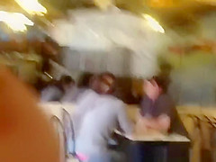 Pink thong exposed at cafe table