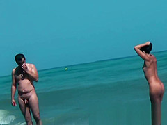 Sexy beach nudist girls get their hot booties admired