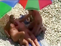 Threesome sex fun on public beach caught on cam
